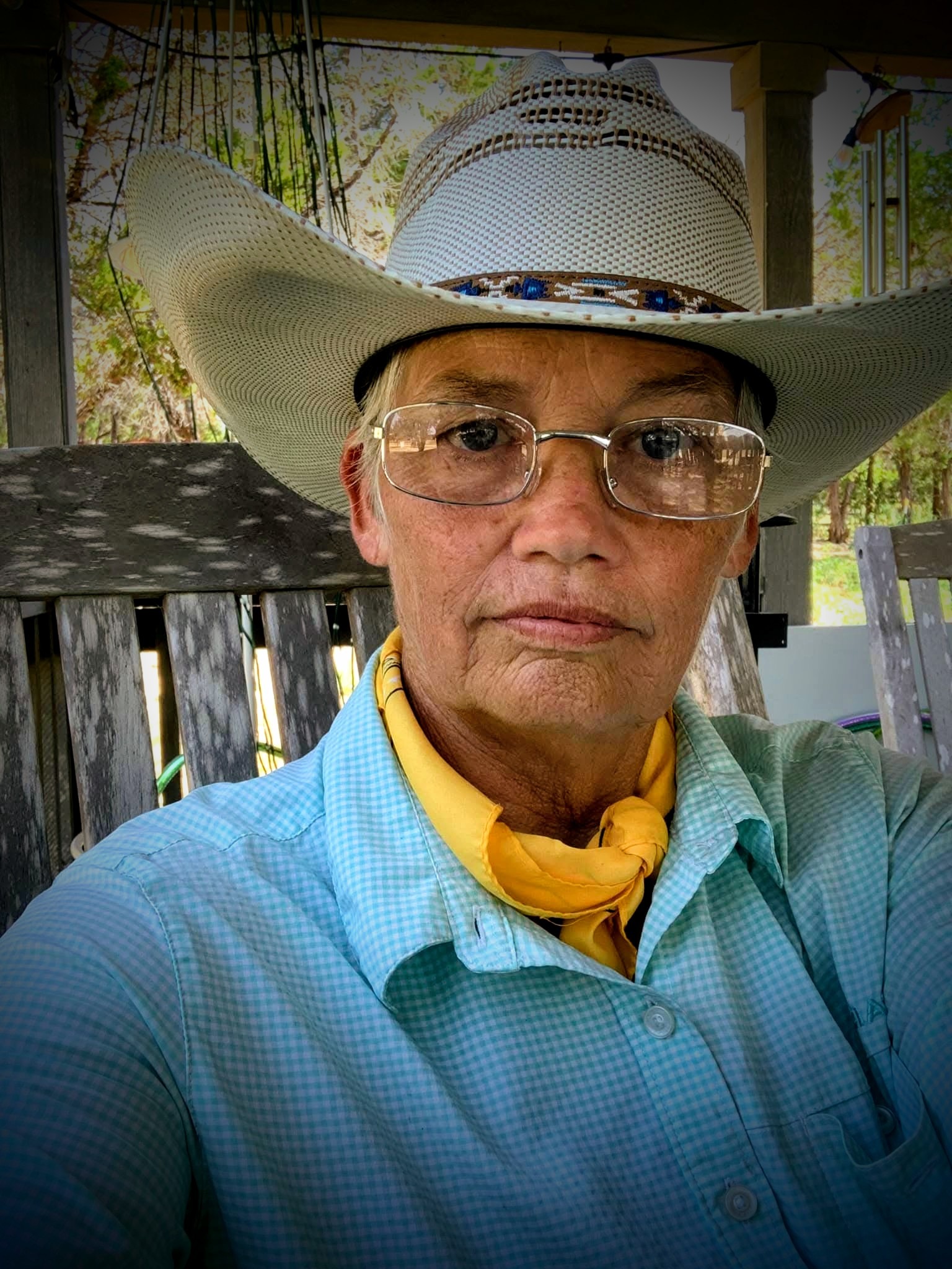 Author BJ Stone wearing a cowboy hat